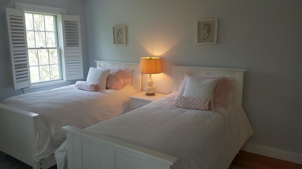 102 Marsh View Road Chatham, MA 02633 - Photo 23 of 23 a bedroom with two beds and a window