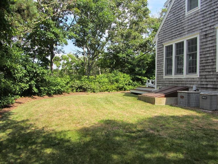 102 Marsh View Road Chatham, MA 02633 - Photo 6 of 23 a swimming pool with outdoor seating and yard