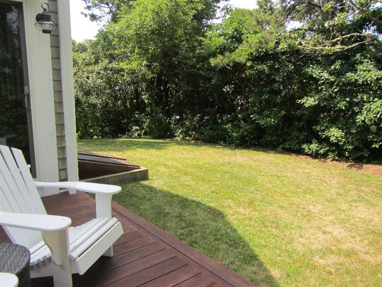 102 Marsh View Road Chatham, MA 02633 - Photo 7 of 23 a view of a balcony with chair and wooden floor