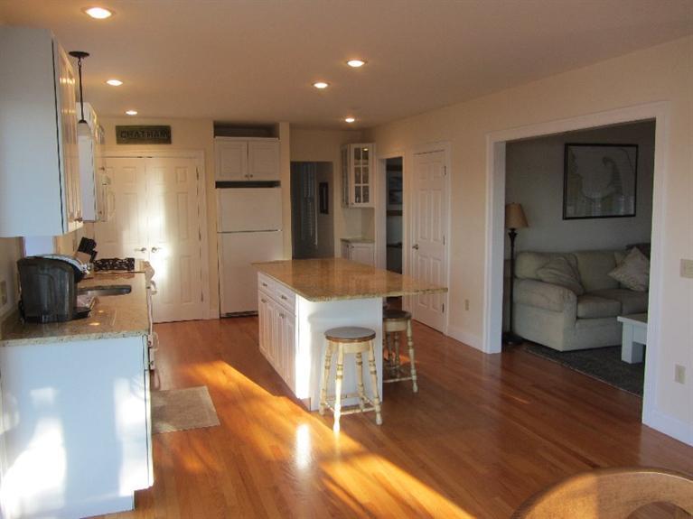 102 Marsh View Road Chatham, MA 02633 - Photo 9 of 23 a kitchen with a refrigerator and a sink