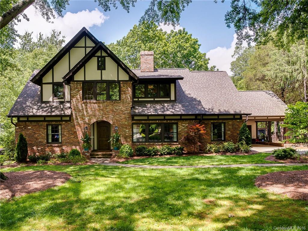 1418 Audubon Road Charlotte, NC 28211 - Photo 1 of 24 a front view of a house with yard and trees