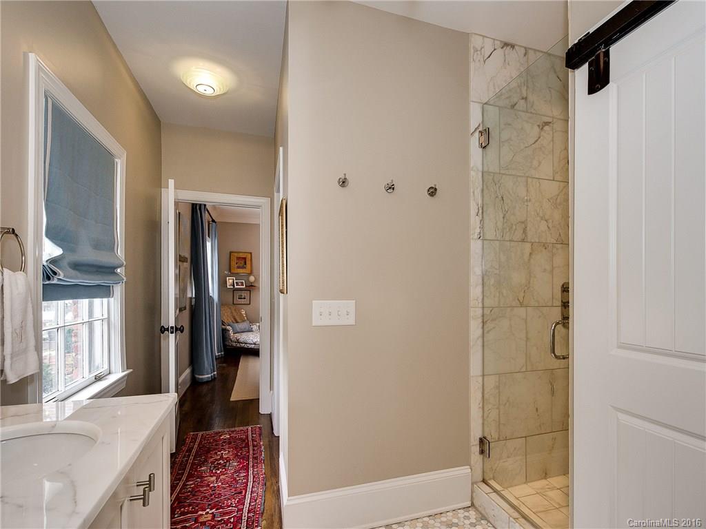 1418 Audubon Road Charlotte, NC 28211 - Photo 13 of 24 a bathroom with a shower and a bath tub