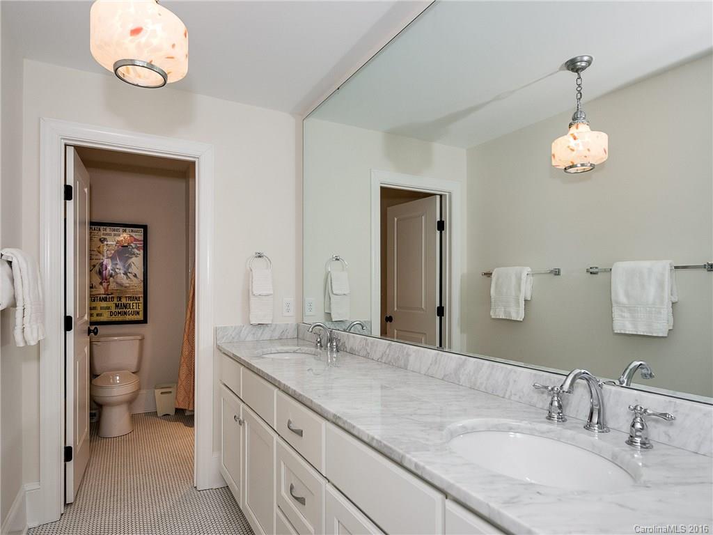 1418 Audubon Road Charlotte, NC 28211 - Photo 18 of 24 a bathroom with a granite countertop sink and a mirror