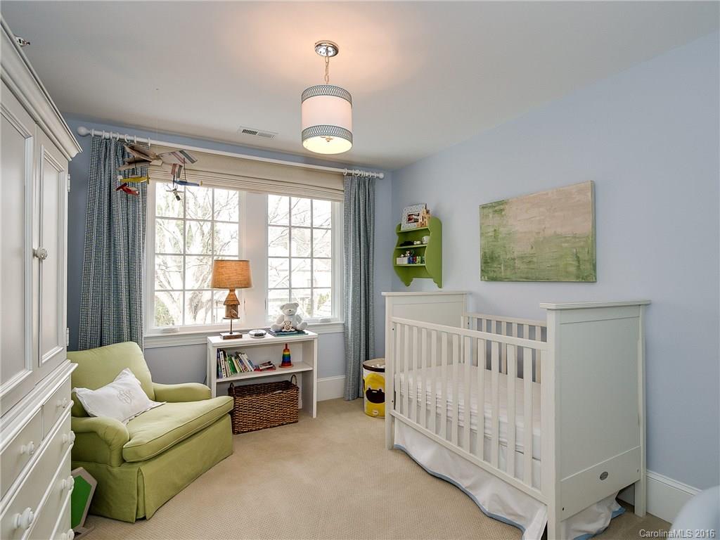 1418 Audubon Road Charlotte, NC 28211 - Photo 21 of 24 a bedroom with furniture and a large window