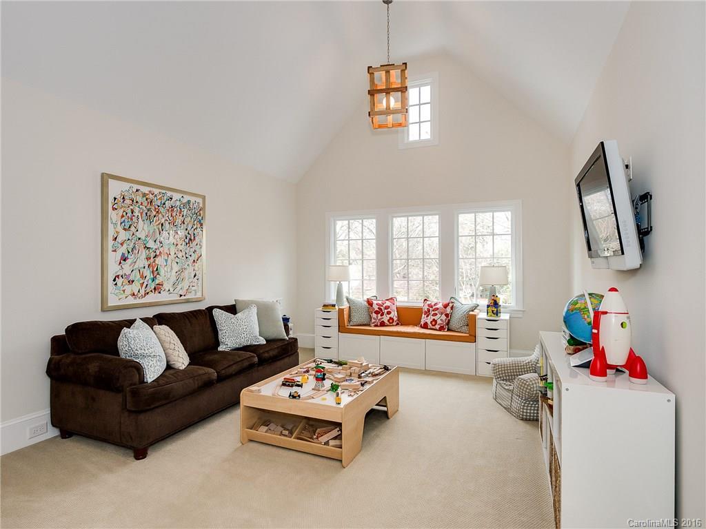 1418 Audubon Road Charlotte, NC 28211 - Photo 22 of 24 a living room with furniture and a flat screen tv