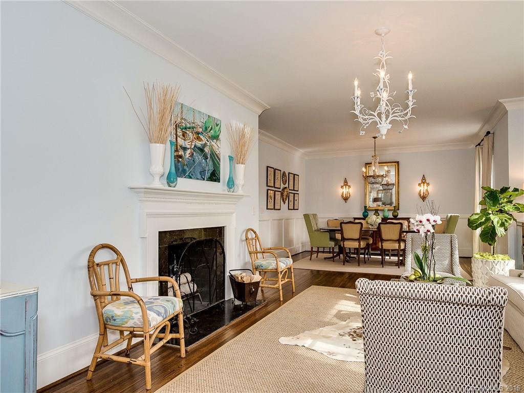 1418 Audubon Road Charlotte, NC 28211 - Photo 4 of 24 a living room with furniture a chandelier and a fireplace