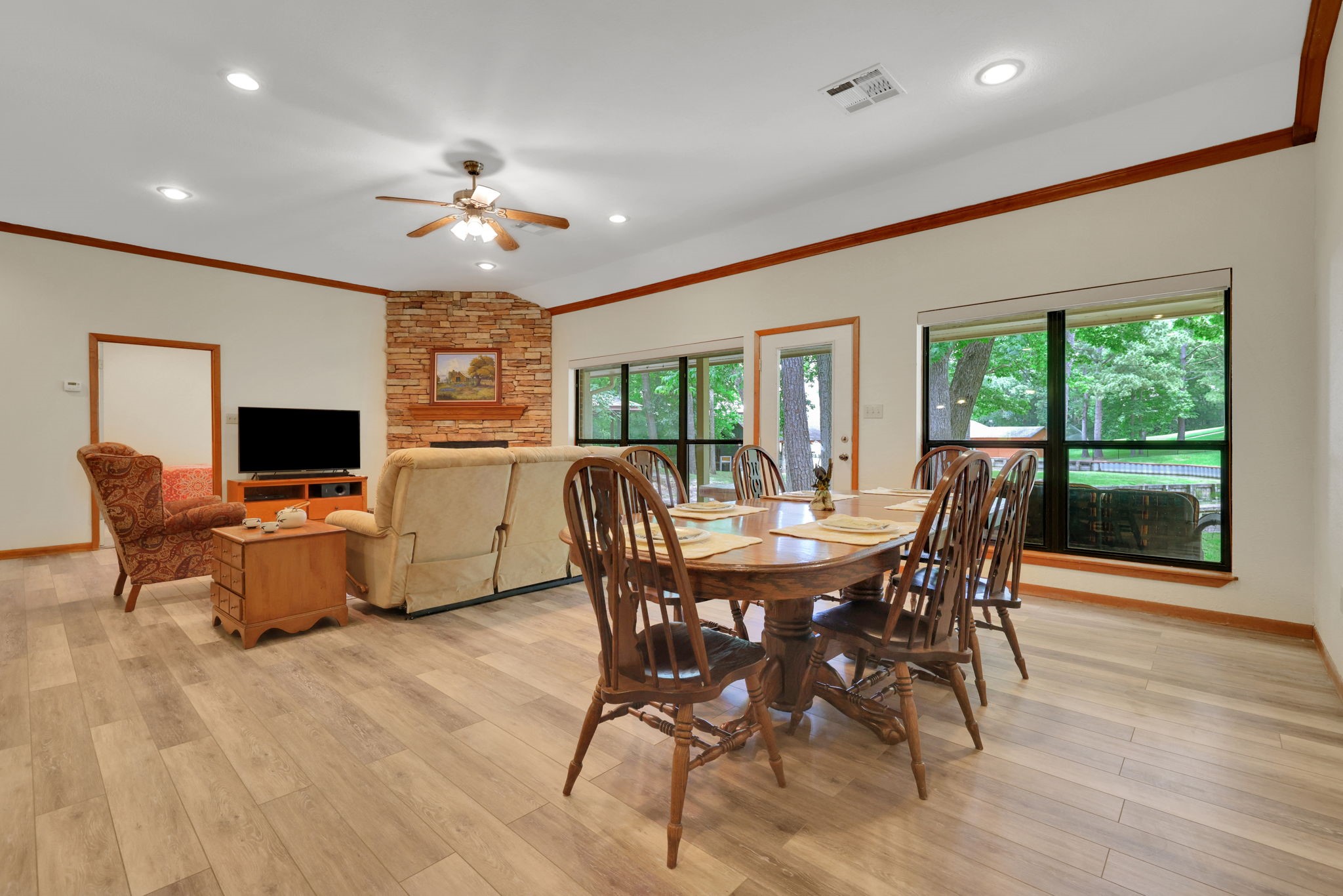 210 Harbor Run Drive Coldspring, TX 77331 - Photo 12 of 43 a view of a dining room with furniture window and wooden floor