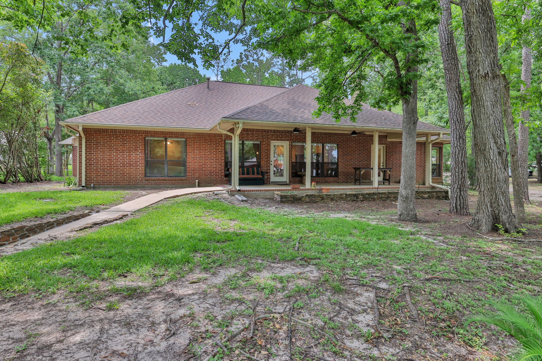 210 Harbor Run Drive Coldspring, TX 77331 - Photo 18 of 43 front view of a house with a yard