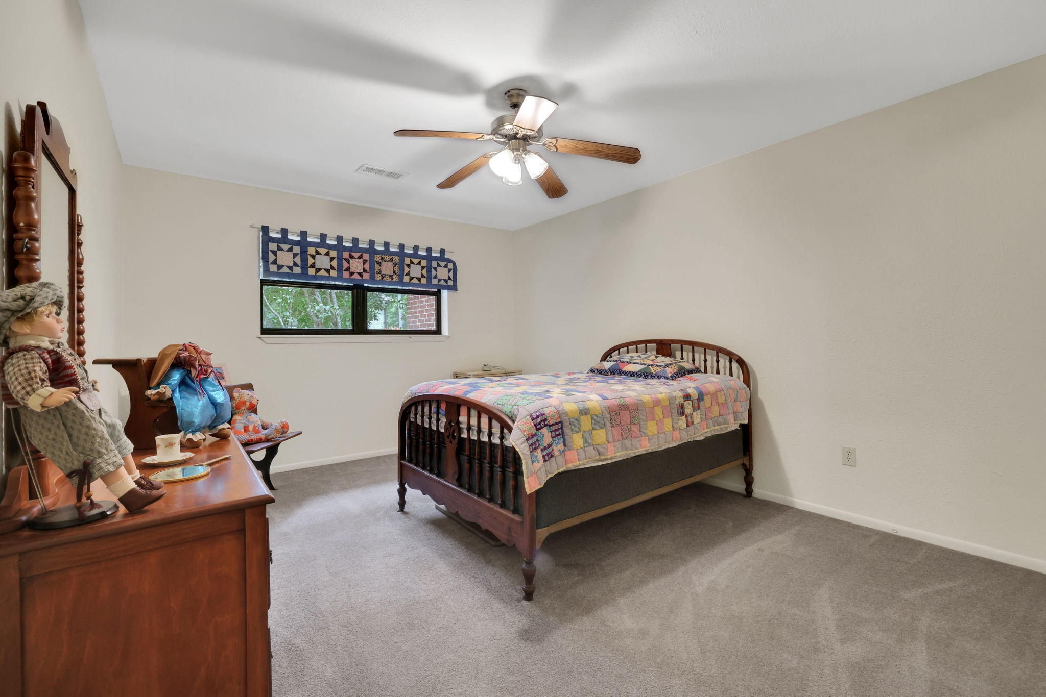 210 Harbor Run Drive Coldspring, TX 77331 - Photo 31 of 43 a bedroom with bed and a chandelier