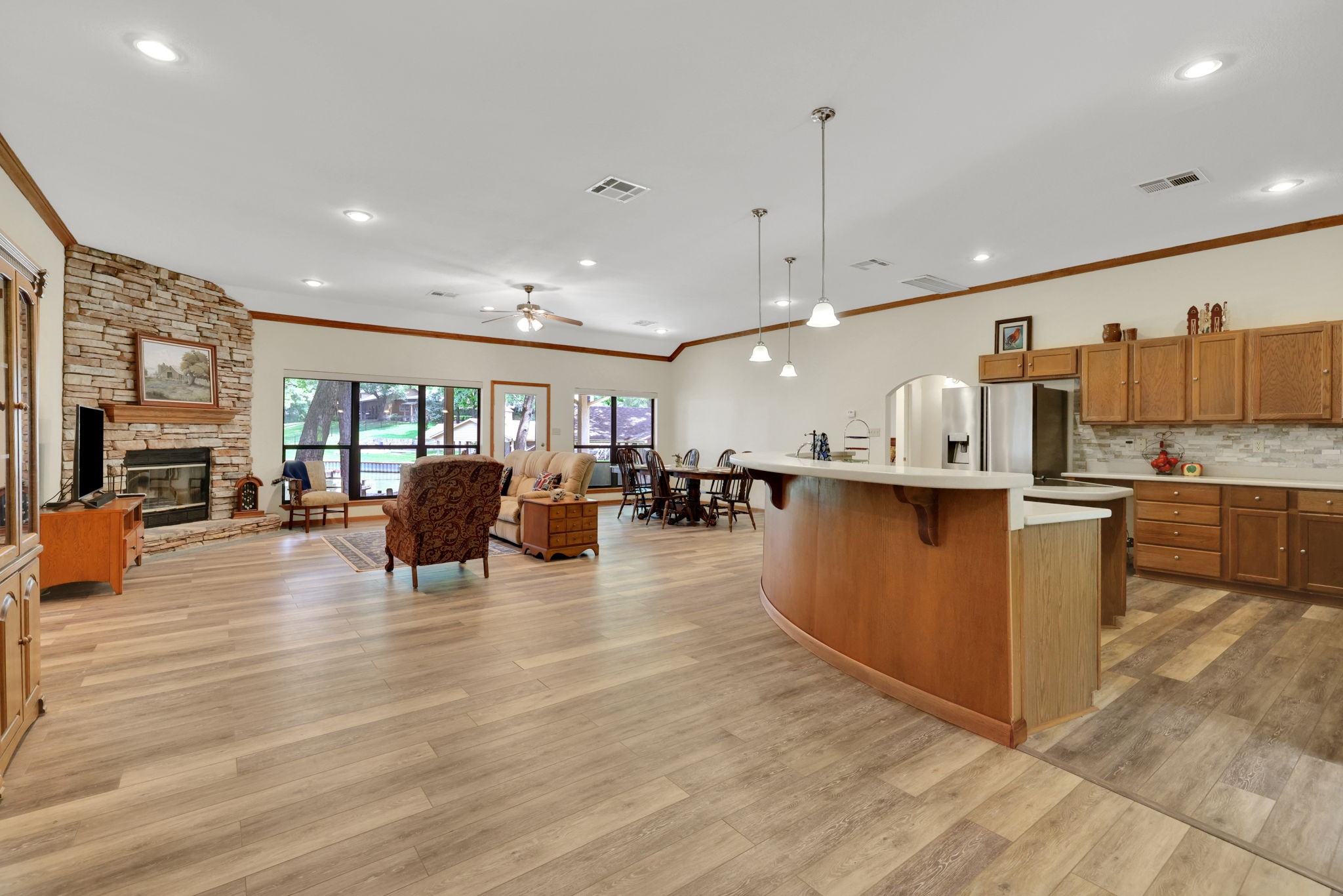 210 Harbor Run Drive Coldspring, TX 77331 - Photo 4 of 43 a living room with lots of furniture and kitchen view