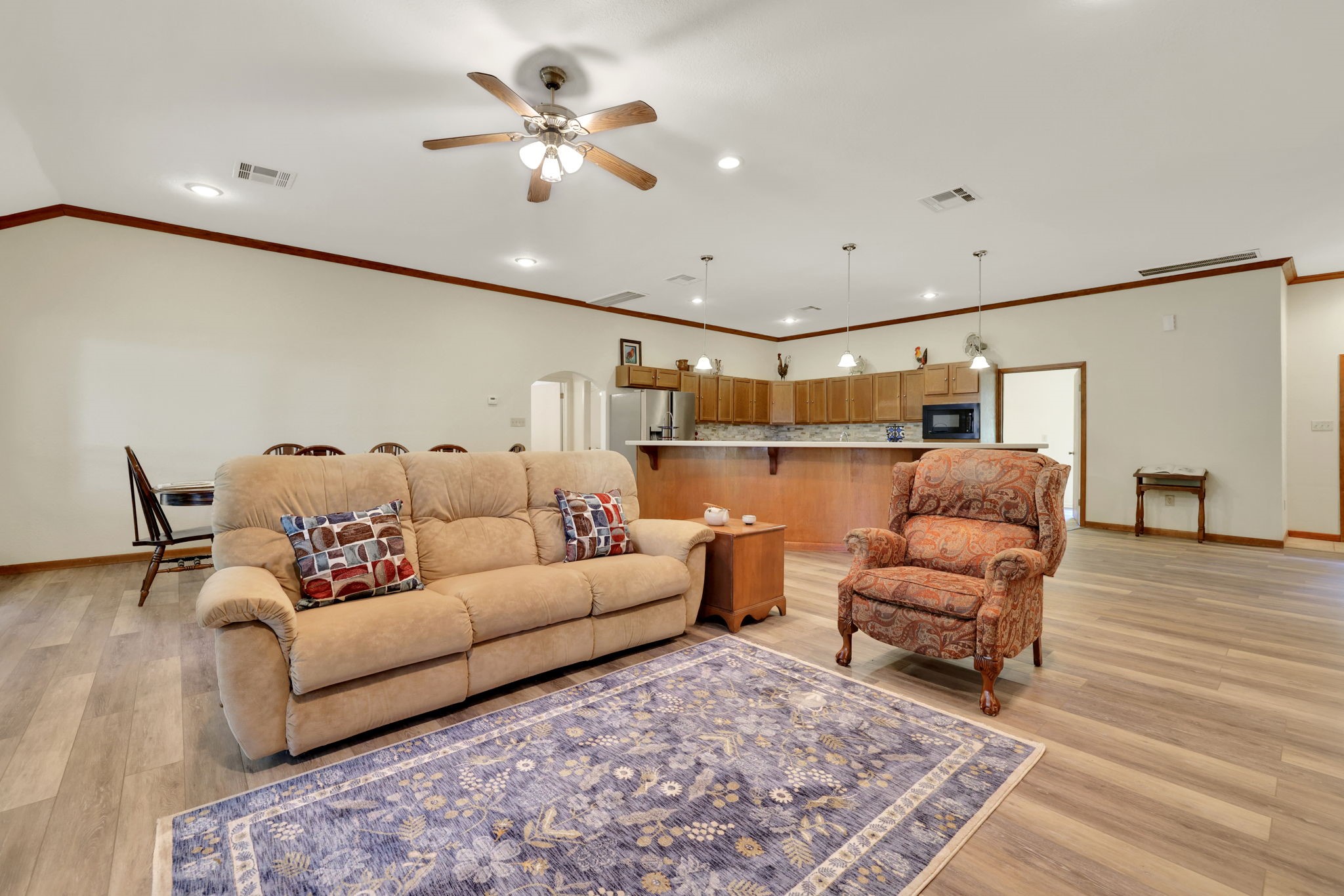 210 Harbor Run Drive Coldspring, TX 77331 - Photo 7 of 43 a living room with furniture and a wooden floor