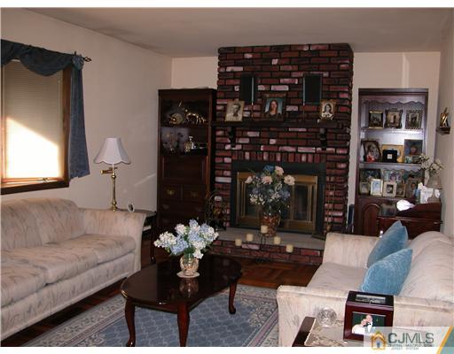 22 Harding Avenue Edison, NJ 08820 - Photo 12 of 14 a living room with furniture and wooden floor