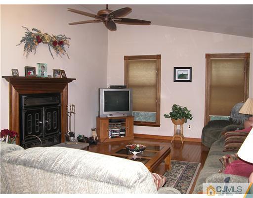 22 Harding Avenue Edison, NJ 08820 - Photo 13 of 14 a bedroom with a bed and a flat screen tv