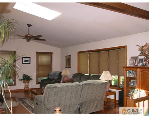 22 Harding Avenue Edison, NJ 08820 - Photo 14 of 14 a living room with furniture tv and a large window
