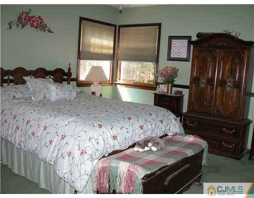 22 Harding Avenue Edison, NJ 08820 - Photo 4 of 14 a bedroom with a bed window and dresser