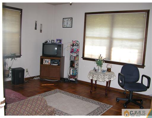 22 Harding Avenue Edison, NJ 08820 - Photo 7 of 14 a living room with furniture and a window