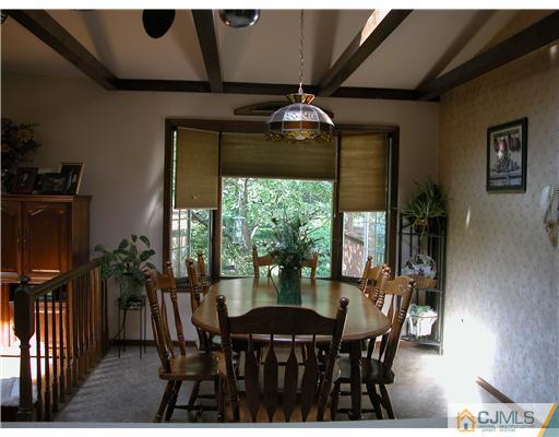 22 Harding Avenue Edison, NJ 08820 - Photo 9 of 14 a view of a dining room with furniture window and outside view