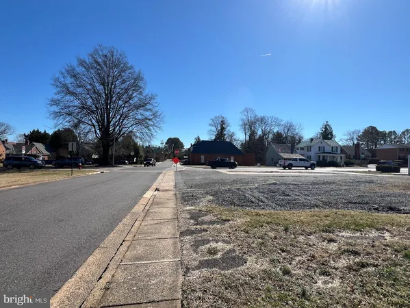 a view of road with houses