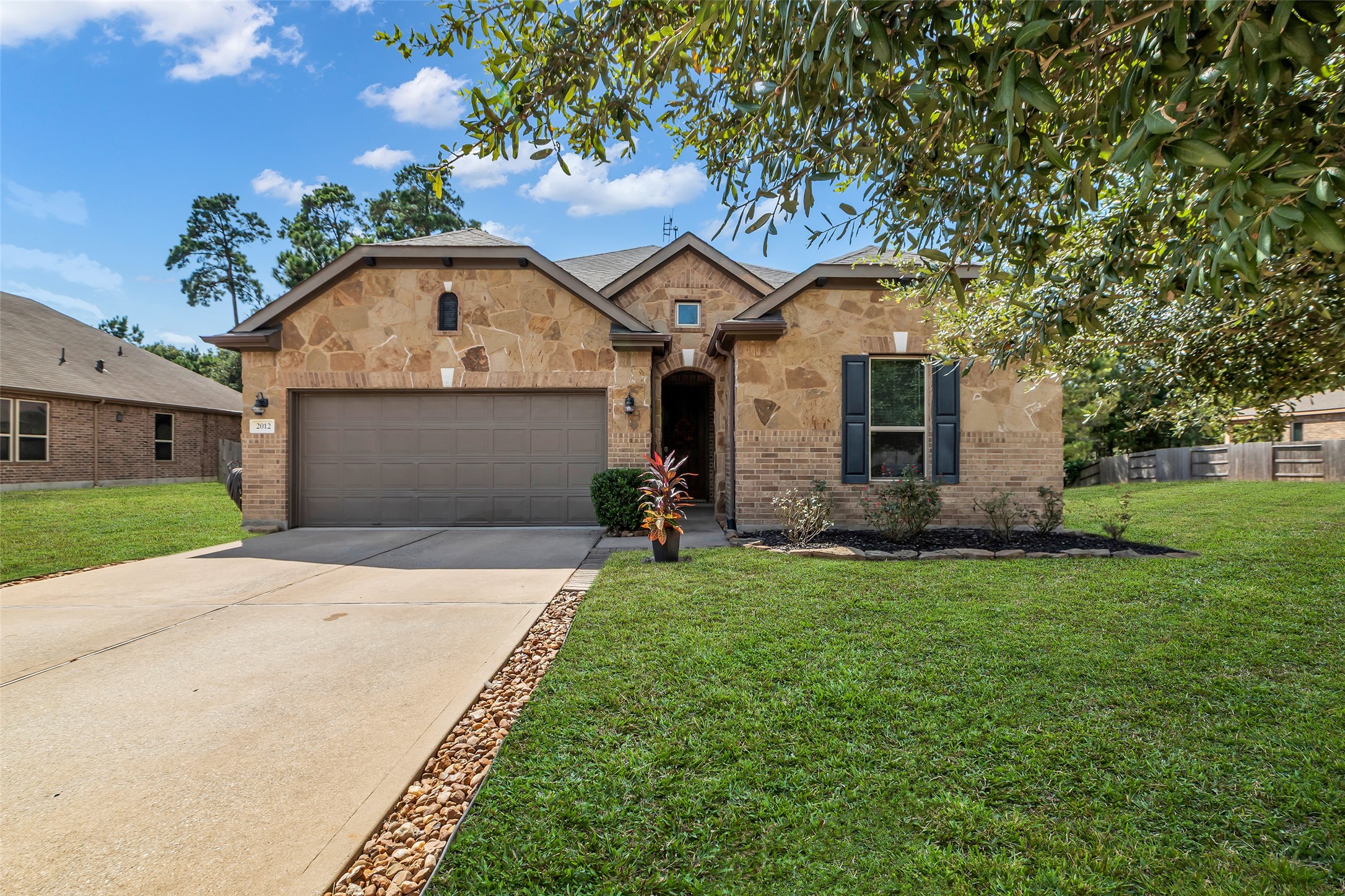 2012 Elkington Circle Conroe, TX 77304 - Photo 1 of 36 a front view of house with yard