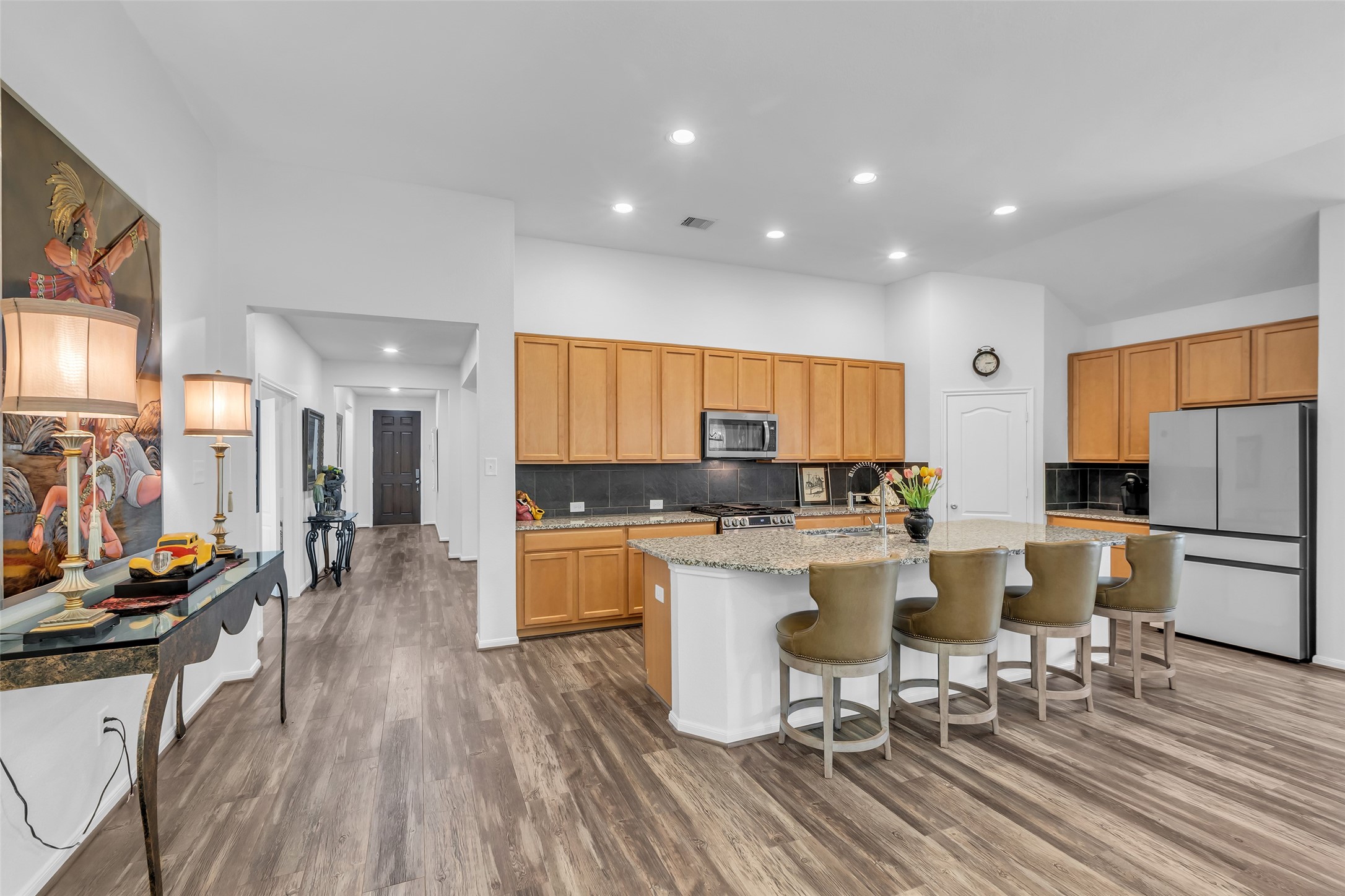 2012 Elkington Circle Conroe, TX 77304 - Photo 15 of 36 a kitchen with a sink a counter top space and stainless steel appliances