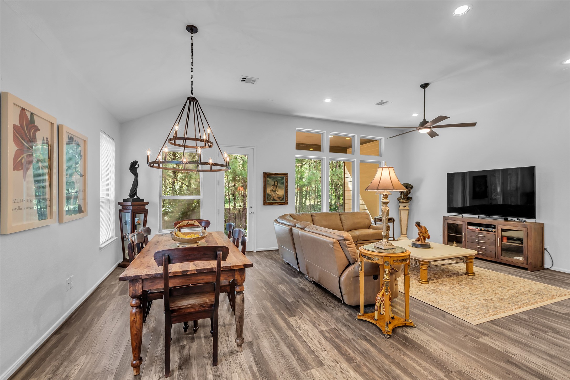 2012 Elkington Circle Conroe, TX 77304 - Photo 16 of 36 a living room with furniture a flat screen tv and a window