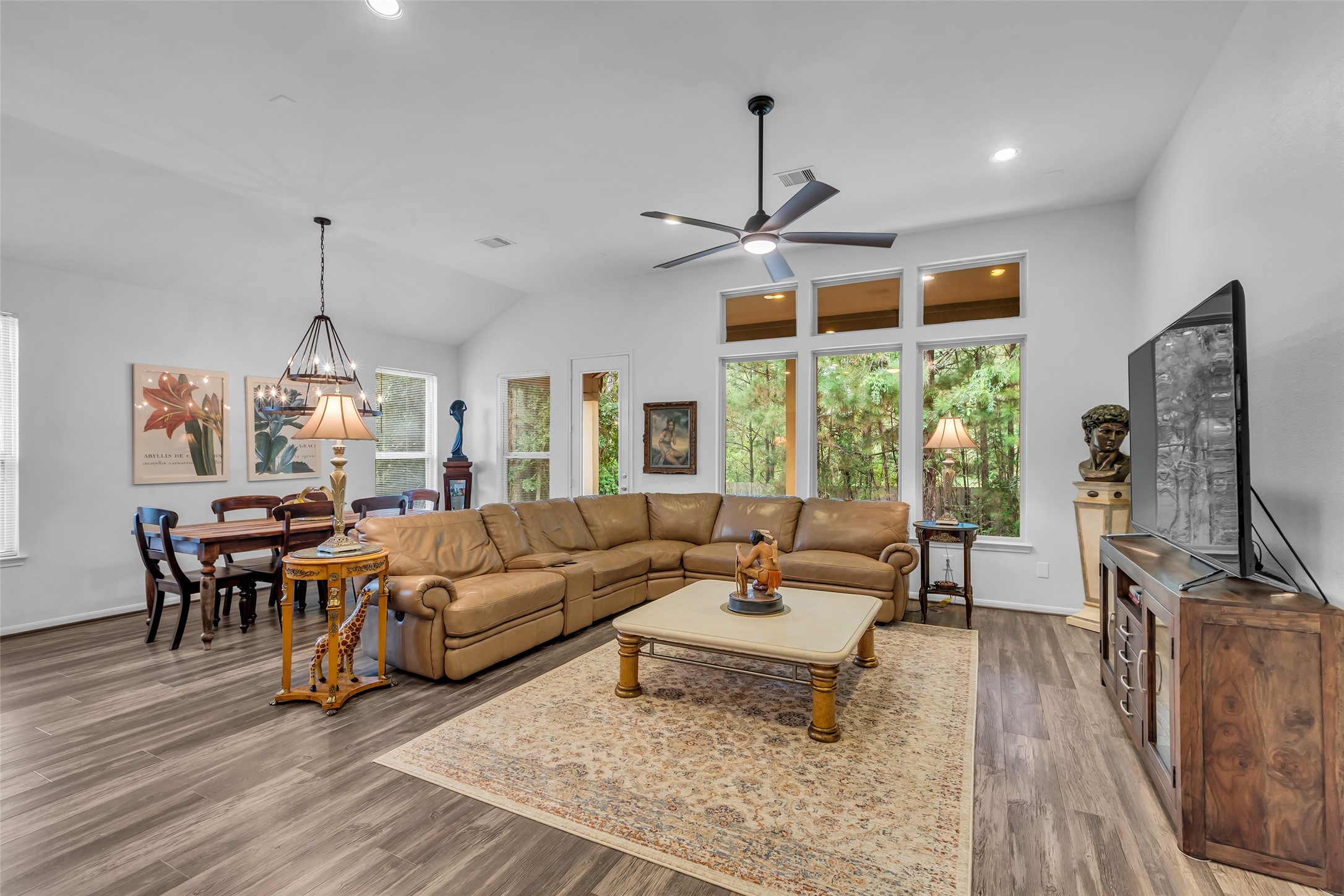 2012 Elkington Circle Conroe, TX 77304 - Photo 21 of 36 a living room with furniture a window and gym equipment