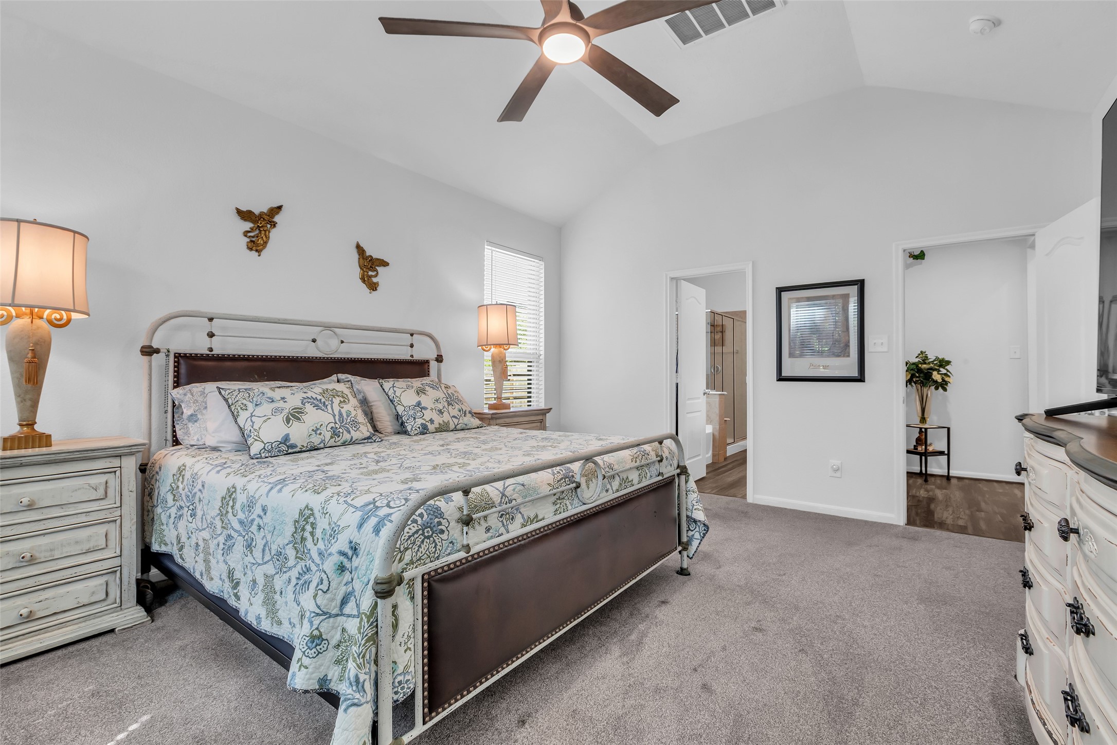 2012 Elkington Circle Conroe, TX 77304 - Photo 24 of 36 a bedroom with a bed and ceiling fan