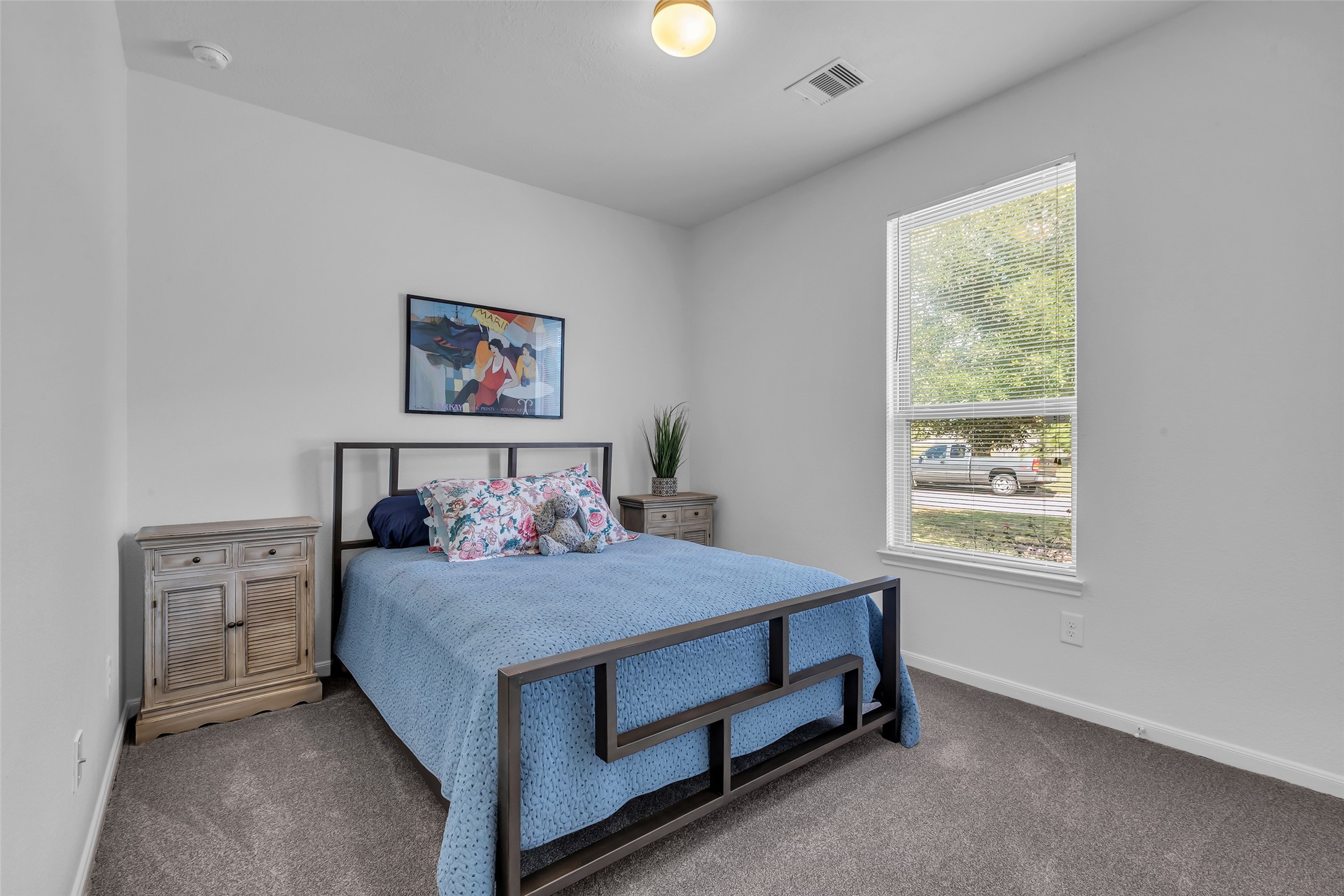2012 Elkington Circle Conroe, TX 77304 - Photo 27 of 36 a bedroom with a bed and a window