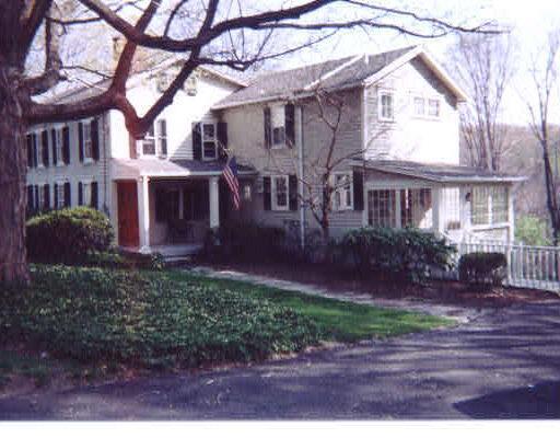 782 Ridgefield Road Wilton, CT 06897 - Photo 1 of 1 a view of a yard in front of a house