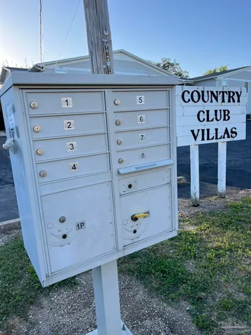 a view of outdoor space with signage and flags