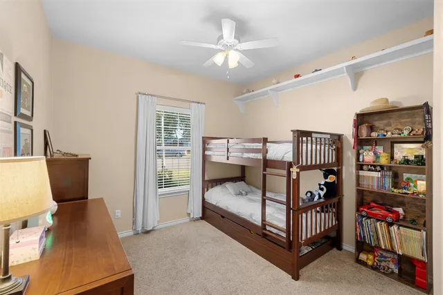 a bedroom with furniture and white walls