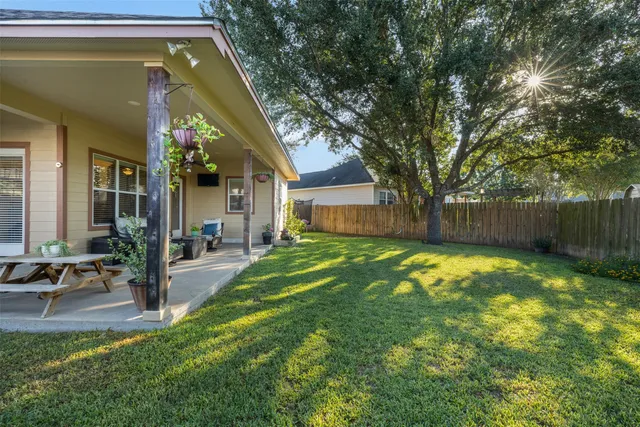 a view of house with swimming pool outdoor seating