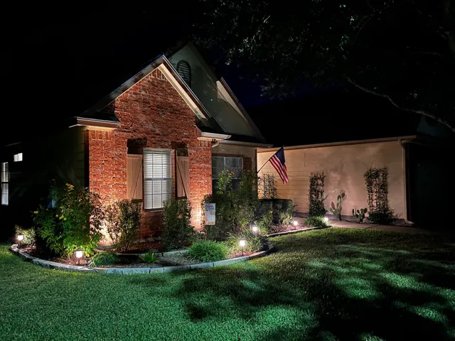 a front view of house with a garden