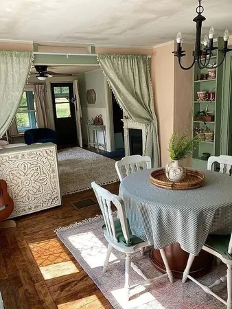 a view of a livingroom with furniture and window