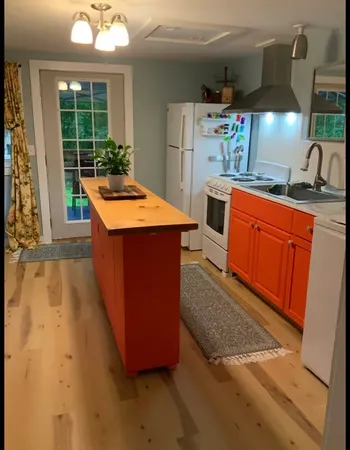 a dining room with table and chairs
