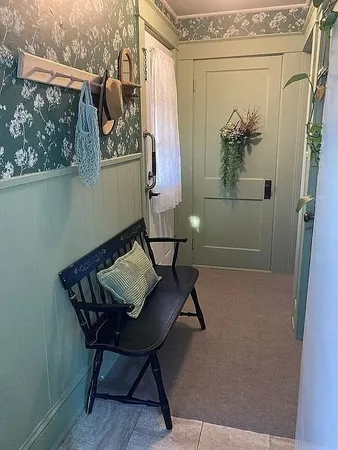 a balcony with table and chairs