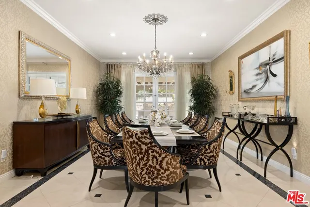 a living room with furniture and painting on the wall