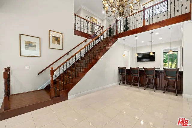 a bathroom with a granite countertop sink a mirror and shower