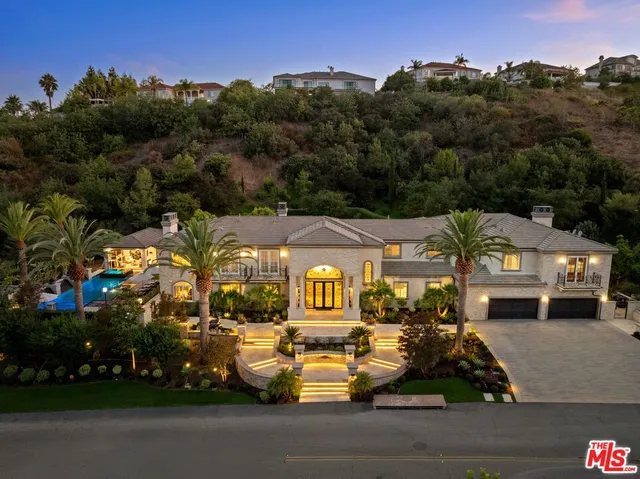 a living room with furniture or kitchen and a chandelier
