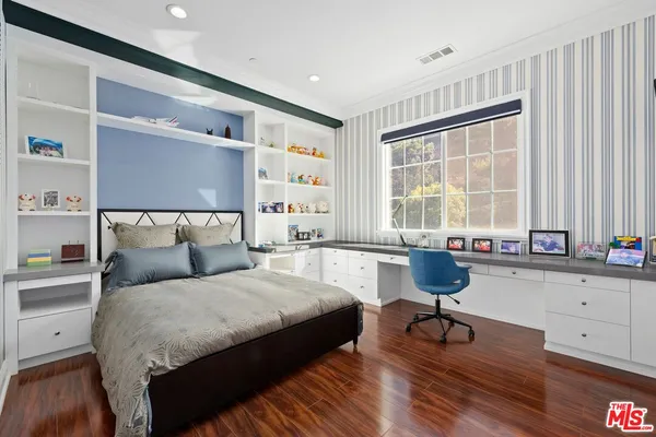 a view of a swimming pool with lounge chairs in patio