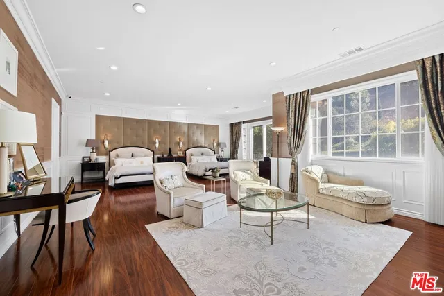 a view of a patio with a dining table and chairs with wooden floor