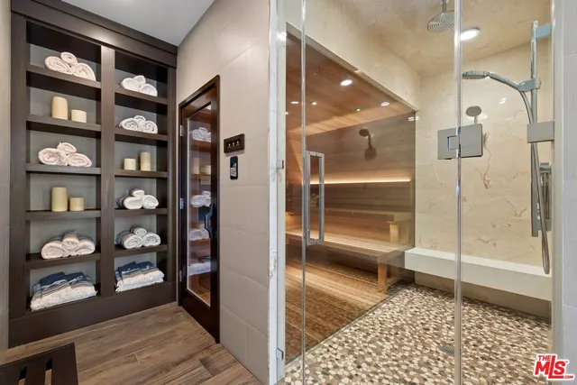 a view of a house with swimming pool and sitting area