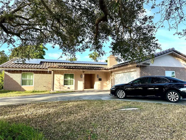 a car parked in front of a house