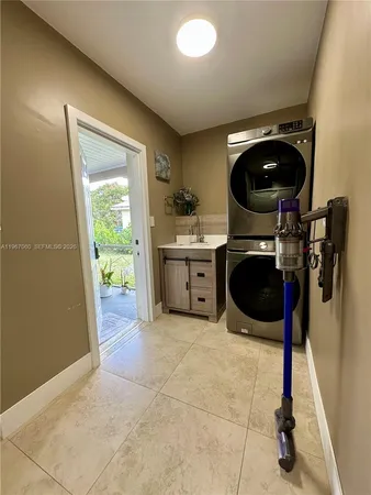a kitchen with a sink and a stove