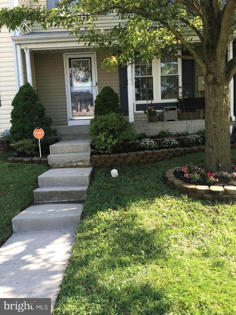 5023 Clifford Road Perry Hall, MD 21128 - Photo 1 of 28 a front view of a house with garden