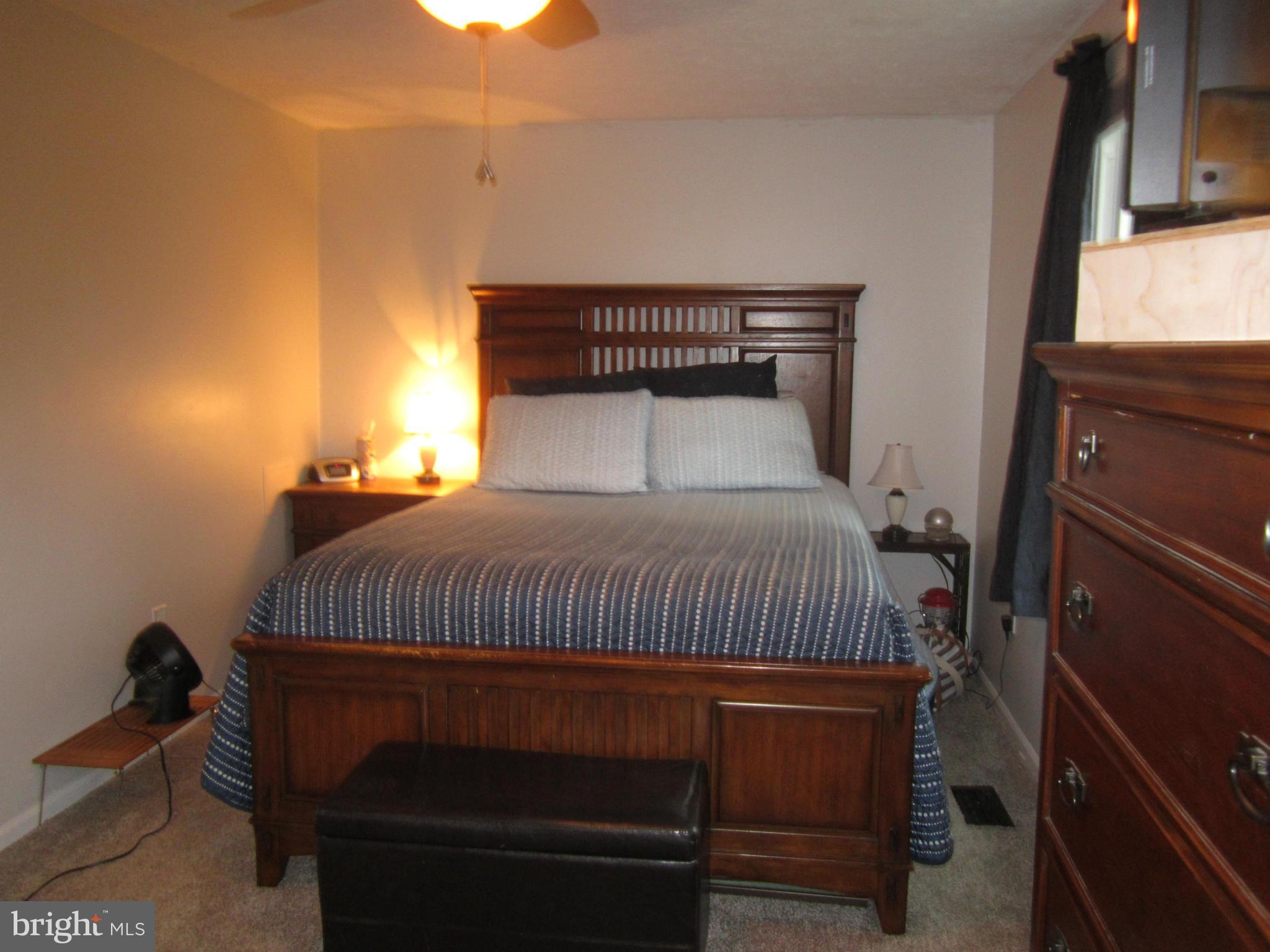 5023 Clifford Road Perry Hall, MD 21128 - Photo 14 of 28 a bedroom with a bed and a window