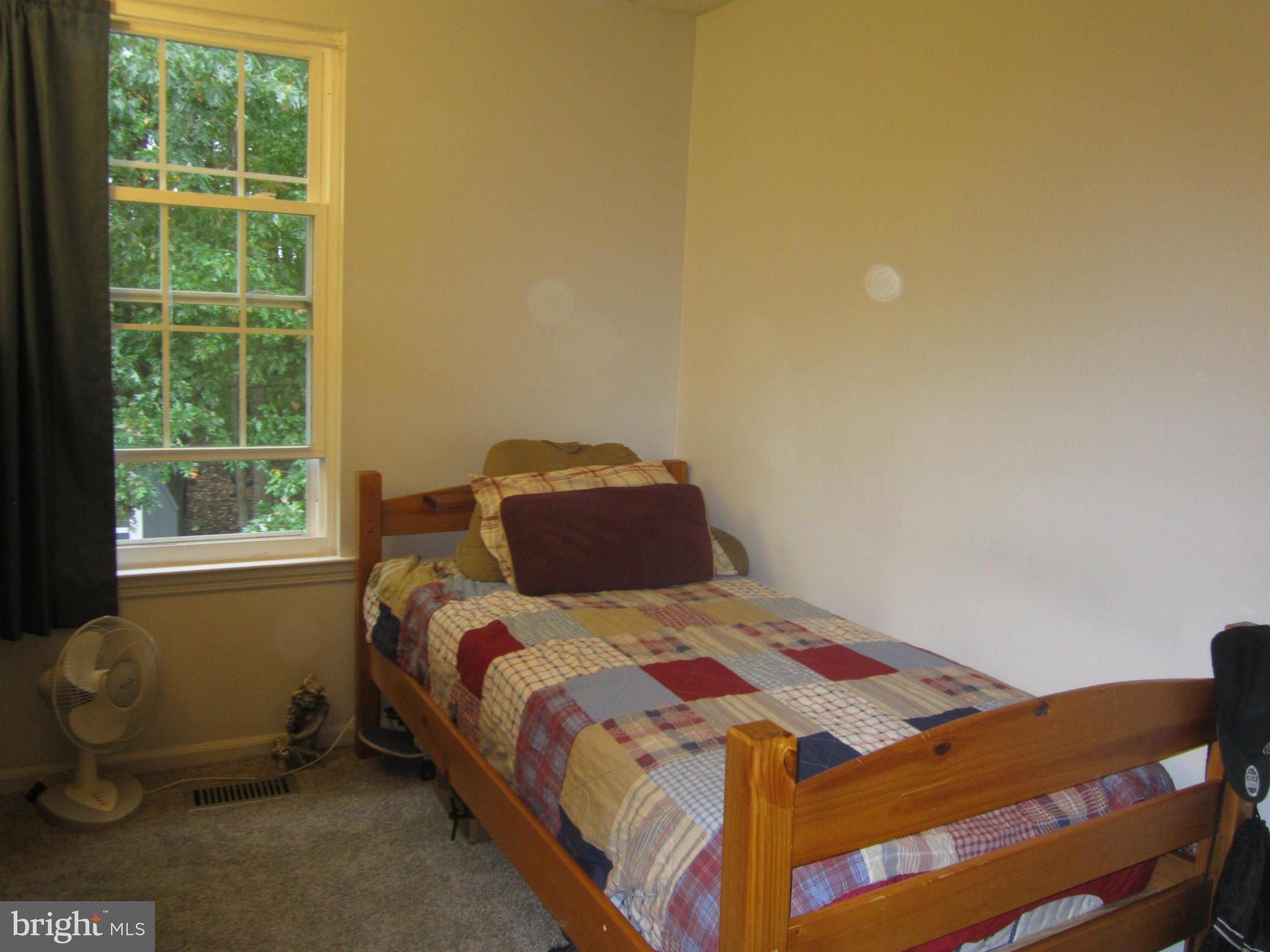 5023 Clifford Road Perry Hall, MD 21128 - Photo 20 of 28 a bedroom with a bed and a window