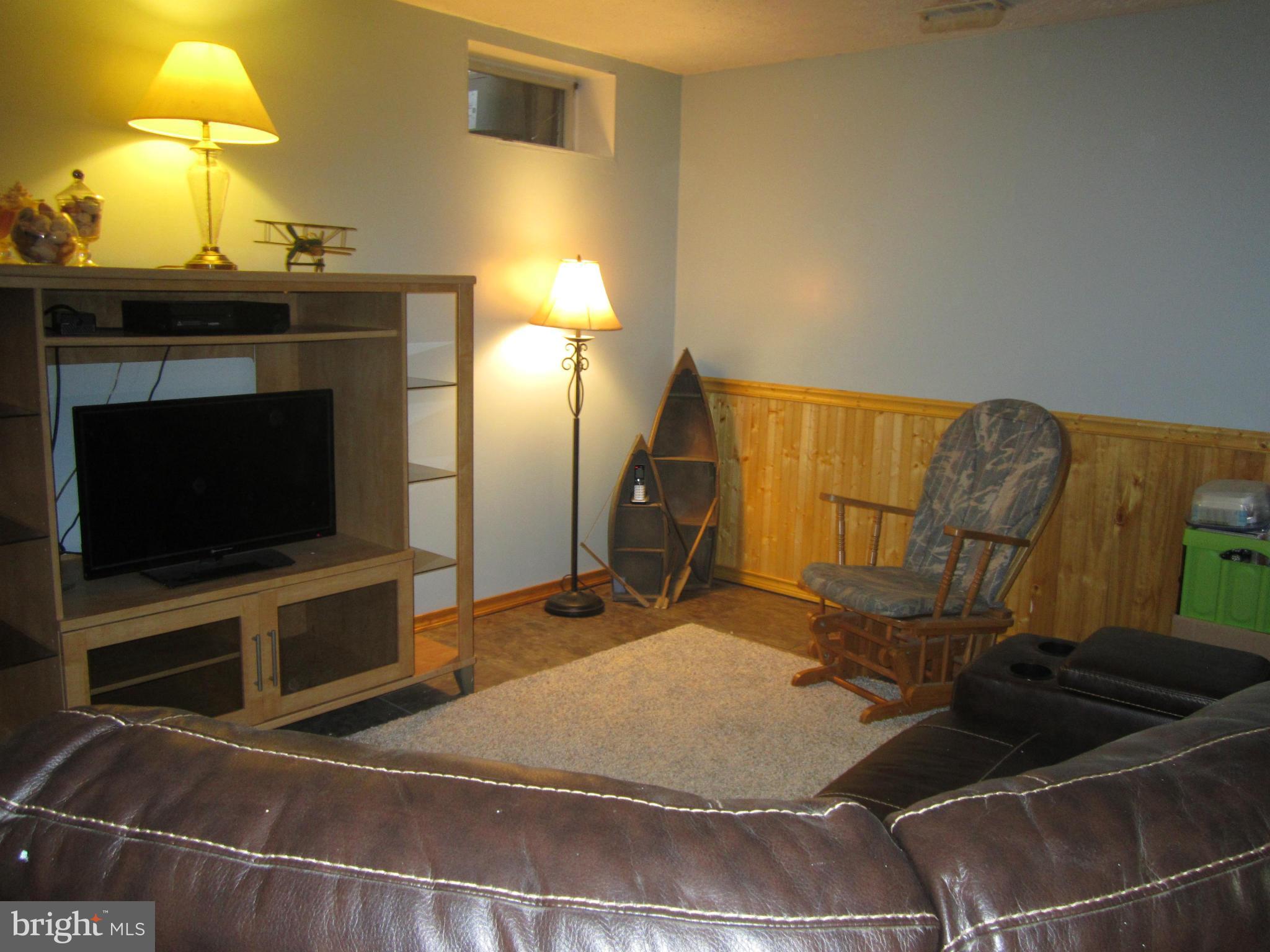 5023 Clifford Road Perry Hall, MD 21128 - Photo 23 of 28 a room with a flat screen tv and a fireplace
