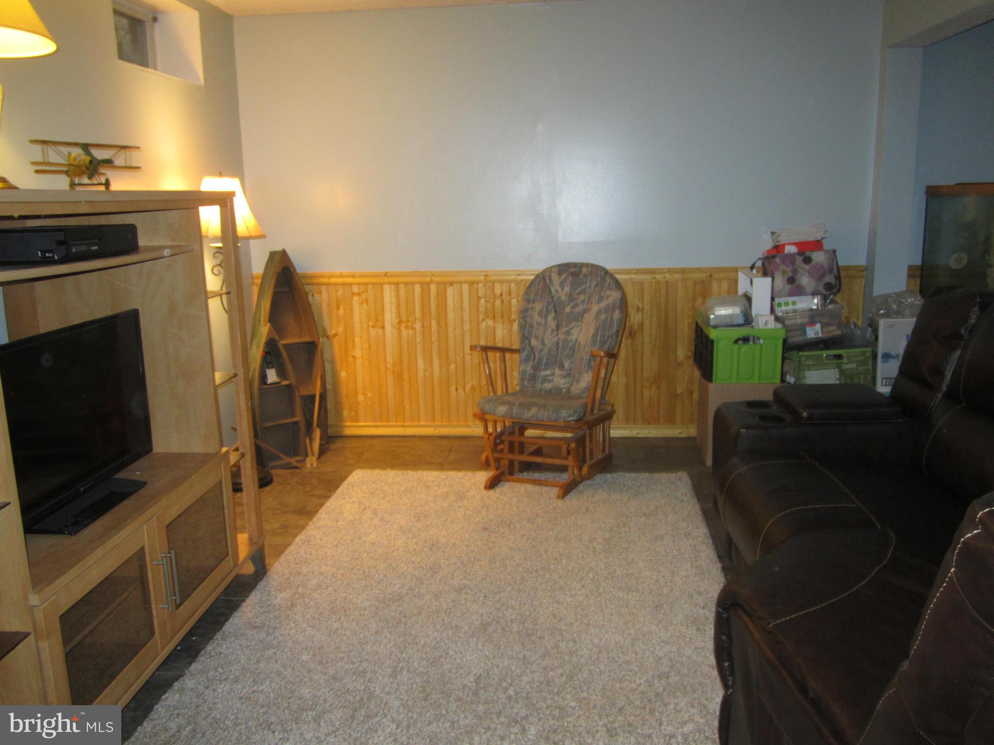 5023 Clifford Road Perry Hall, MD 21128 - Photo 25 of 28 a view of a livingroom with furniture and a flat screen tv