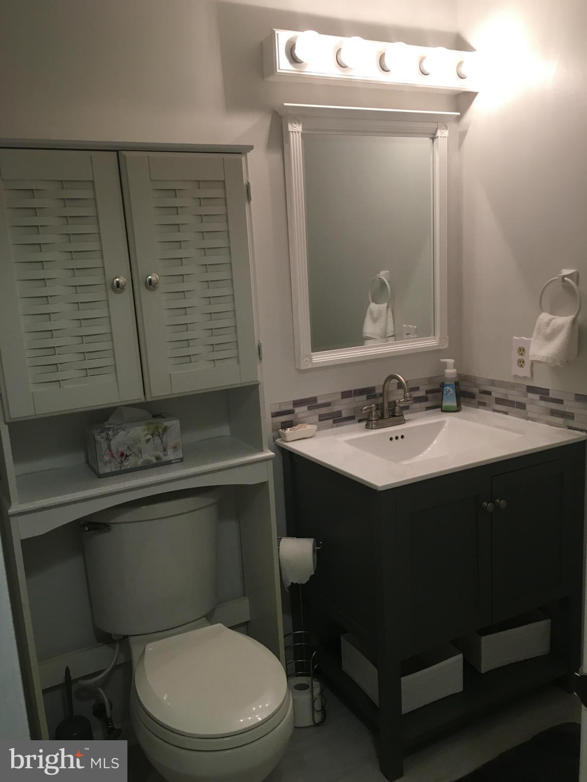 5023 Clifford Road Perry Hall, MD 21128 - Photo 28 of 28 a bathroom with a toilet sink and mirror